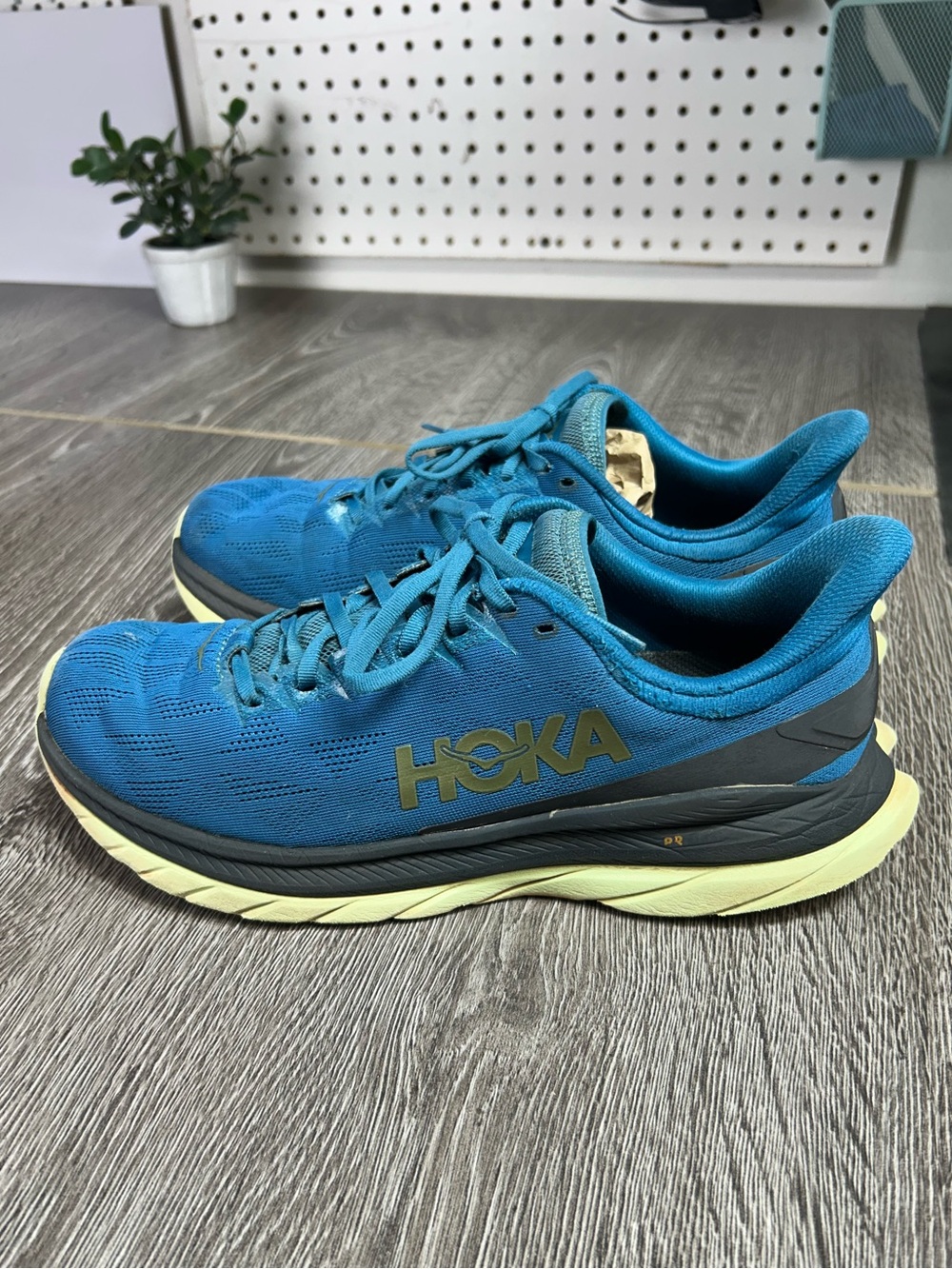 HOKA men’s Blue Athletic Running Shoes with Yellow Sole size 10D